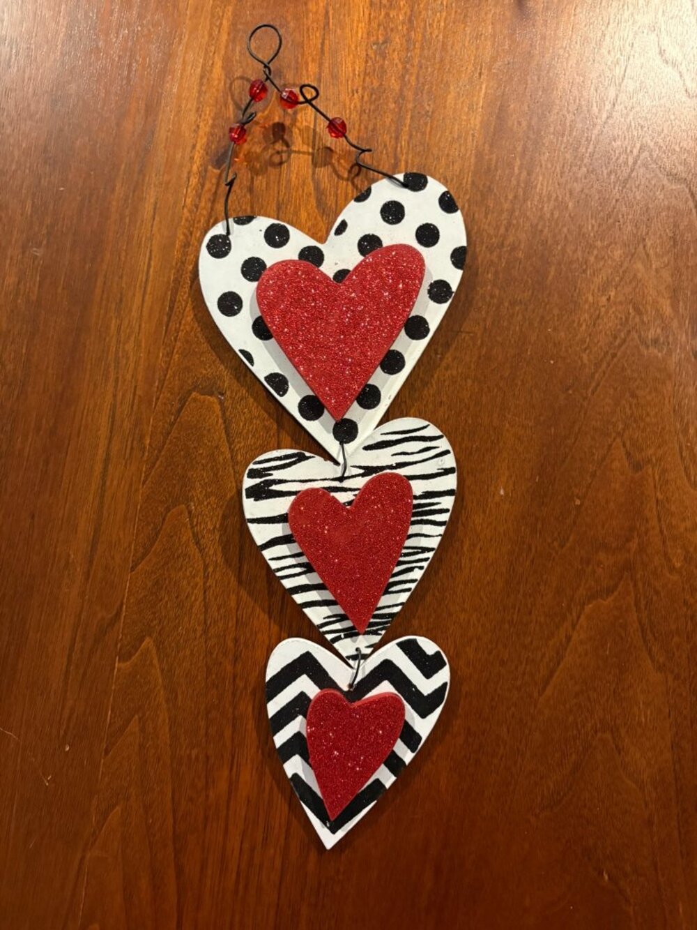 Three heart wall hanging, red, black, white, some glitter